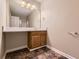 Bathroom with sink, vanity and mirror providing a functional space at 62 Sweetwater Pkwy, Powder Springs, GA 30127