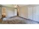 Spacious bedroom with carpet, ceiling fan, and closet, offering comfort and ample storage at 62 Sweetwater Pkwy, Powder Springs, GA 30127