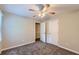 Cozy bedroom with carpet, ceiling fan, and closet, providing a comfortable retreat at 62 Sweetwater Pkwy, Powder Springs, GA 30127