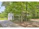 Features a two-car garage and private setting surrounded by lush trees and an oversized driveway at 62 Sweetwater Pkwy, Powder Springs, GA 30127