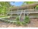 Beautiful home with a large front porch and well-maintained landscaping, perfect for enjoying the outdoors at 62 Sweetwater Pkwy, Powder Springs, GA 30127