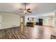 Open-concept living area with hardwood floors, view of kitchen and dining area, and spacious layout at 62 Sweetwater Pkwy, Powder Springs, GA 30127