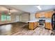 Open living room and kitchen area with wood floors and neutral colors, perfect for modern living at 62 Sweetwater Pkwy, Powder Springs, GA 30127