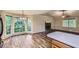 Inviting living room featuring a fireplace, wood floors, and natural light from a large bay window at 62 Sweetwater Pkwy, Powder Springs, GA 30127
