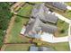 Aerial view of the home showcasing its roofline, back patio, landscaping, driveway, and location within the neighborhood at 6329 Granbury Walk, Acworth, GA 30101