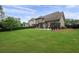 Expansive backyard featuring a well-manicured lawn, fence, and a patio area perfect for outdoor entertaining at 6329 Granbury Walk, Acworth, GA 30101