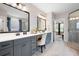 Beautiful bathroom featuring dual vanities, framed mirrors, and walk-in shower at 6329 Granbury Walk, Acworth, GA 30101