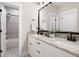 Bright bathroom with a dual sink vanity and a shower-tub combination at 6329 Granbury Walk, Acworth, GA 30101