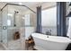 Elegant bathroom with a glass shower, soaking tub, and neutral color palette at 6329 Granbury Walk, Acworth, GA 30101