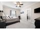 Comfortable bedroom with plush carpet, ceiling fan, and walk-in closet at 6329 Granbury Walk, Acworth, GA 30101