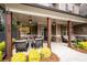 Inviting front porch with cozy seating area and hanging lanterns, perfect for relaxing at 6329 Granbury Walk, Acworth, GA 30101
