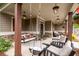 Relaxing front porch featuring a porch swing, comfortable seating, and stylish lighting at 6329 Granbury Walk, Acworth, GA 30101