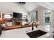 Gourmet kitchen with white cabinets, stone countertops, and views to the living room at 6329 Granbury Walk, Acworth, GA 30101