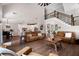 Spacious living room open to the kitchen and featuring wood floors and a staircase at 6329 Granbury Walk, Acworth, GA 30101