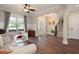 Spacious living room with hardwood floors, natural light, and a view of the foyer at 6329 Granbury Walk, Acworth, GA 30101