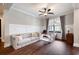 Cozy living room with stylish couch, hardwood floors, and large window at 6329 Granbury Walk, Acworth, GA 30101