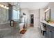 Luxurious bathroom with walk-in shower, soaking tub, dual vanities, and a walk-in closet at 6329 Granbury Walk, Acworth, GA 30101