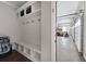 Mudroom with built-in bench, hooks, overhead storage, and access to the garage at 6329 Granbury Walk, Acworth, GA 30101