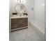 Cozy bathroom featuring a white vanity, round mirror, decorative plants, and tub with white tile at 821 Ralph Mcgill Ne Blvd # 2219, Atlanta, GA 30306