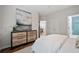 Bedroom with dresser and partial view of bathroom with blue tiled shower at 821 Ralph Mcgill Ne Blvd # 2219, Atlanta, GA 30306