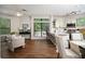 Open-concept kitchen with stainless appliances, breakfast bar, and adjacent living area with large windows at 821 Ralph Mcgill Ne Blvd # 2219, Atlanta, GA 30306