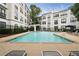 Inviting community pool with lounge chairs, umbrellas, and lush landscaping at 821 Ralph Mcgill Ne Blvd # 2219, Atlanta, GA 30306