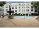 Community pool featuring lounge chairs, umbrellas, and seating areas for residents at 821 Ralph Mcgill Ne Blvd # 2219, Atlanta, GA 30306