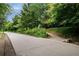 Quiet tree-lined street with sidewalks, landscaping, and community walking path at 821 Ralph Mcgill Ne Blvd # 2219, Atlanta, GA 30306