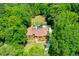 Overhead shot of estate home with pool, cabana, manicured lawn and driveway at 1385 Northcliff Trce, Roswell, GA 30076