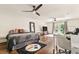 Spacious bedroom with hardwood floors, ceiling fans, and glass doors that provide backyard access at 1385 Northcliff Trce, Roswell, GA 30076
