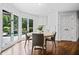 Bright breakfast area with windows overlooking an outdoor pool and landscaped backyard at 1385 Northcliff Trce, Roswell, GA 30076