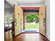 Inviting entryway with double doors and stone archway, offering a glimpse of the landscaped front yard at 1385 Northcliff Trce, Roswell, GA 30076