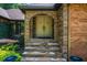 Stone archway and steps leading to the front door at 1385 Northcliff Trce, Roswell, GA 30076