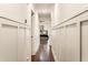 Hallway with wood floors and classic wainscoting at 1385 Northcliff Trce, Roswell, GA 30076