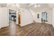 Spacious hallway with hardwood flooring, white trim, and doors to other rooms including a gym at 1385 Northcliff Trce, Roswell, GA 30076