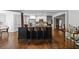 Kitchen island with bar seating, stainless steel appliances, and views into other rooms at 1385 Northcliff Trce, Roswell, GA 30076
