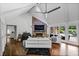 Bright living room featuring hardwood floors, vaulted ceiling, stone fireplace and ample natural light at 1385 Northcliff Trce, Roswell, GA 30076