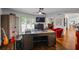 Stylish office with a large desk, hardwood floors, and bright natural light at 1385 Northcliff Trce, Roswell, GA 30076