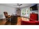 Bright office space with hardwood floors, shutters, and comfortable seating at 1385 Northcliff Trce, Roswell, GA 30076