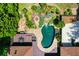 An aerial view of the pool and outdoor area, surrounded by lush landscaping and a patio space at 1385 Northcliff Trce, Roswell, GA 30076