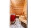 Interior view of the sauna featuring wood paneling, pebble floor and a red heater at 1385 Northcliff Trce, Roswell, GA 30076