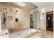 Luxurious walk-in shower featuring stone tile, glass enclosure, and a skylight for bright natural lighting at 1385 Northcliff Trce, Roswell, GA 30076