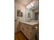 Bathroom featuring a modern single sink vanity, modern fixtures, and decorative mirror at 1800 Clairmont Lk # A226, Decatur, GA 30033