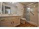Well-lit bathroom featuring a walk-in shower, single sink vanity, and modern fixtures at 1800 Clairmont Lk # A226, Decatur, GA 30033