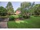 Beautifully landscaped front yard with lush green grass, mature trees, and a winding walkway at 1800 Clairmont Lk # A226, Decatur, GA 30033