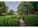 Beautifully landscaped grounds with manicured bushes and walking path at 1800 Clairmont Lk # A226, Decatur, GA 30033