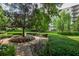 Serene community grounds with manicured hedges, a walking path, and a backdrop of residential building at 1800 Clairmont Lk # A226, Decatur, GA 30033
