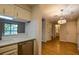 Open kitchen featuring white cabinets, modern countertop, stainless steel appliances and backyard view at 1800 Clairmont Lk # A226, Decatur, GA 30033