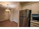Cozy kitchen featuring stainless steel refrigerator and microwave, white cabinets, and modern countertops at 1800 Clairmont Lk # A226, Decatur, GA 30033