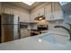 Charming kitchen featuring stainless steel appliances, white subway tile backsplash, and modern countertops at 1800 Clairmont Lk # A226, Decatur, GA 30033